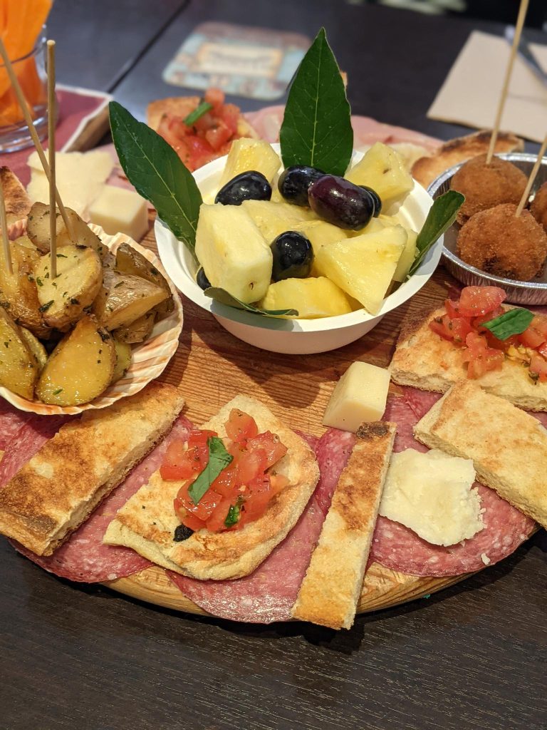 Eat like a local in Italy by visiting a casual enoteca